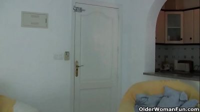 Granny with big tits masturbates in pantyhose